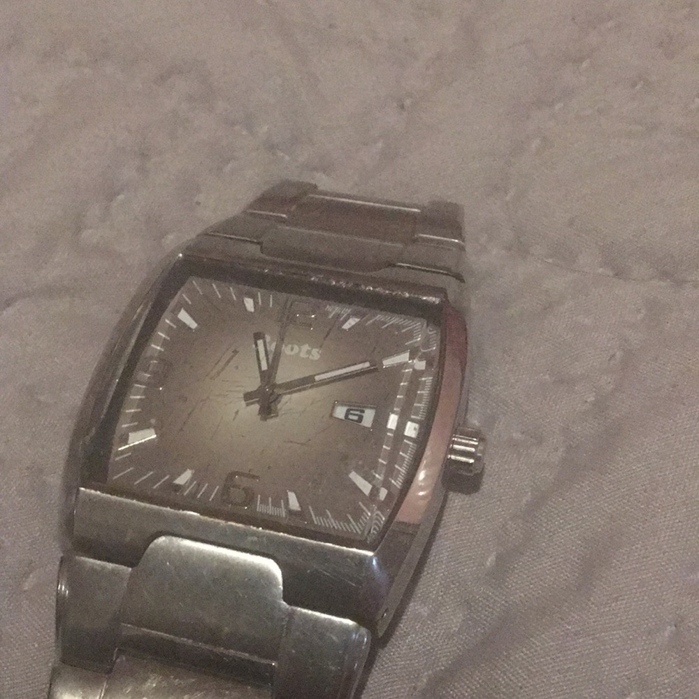 Silver, Roots watch,needs a battery,I can get one? Grey face,manly looking watch